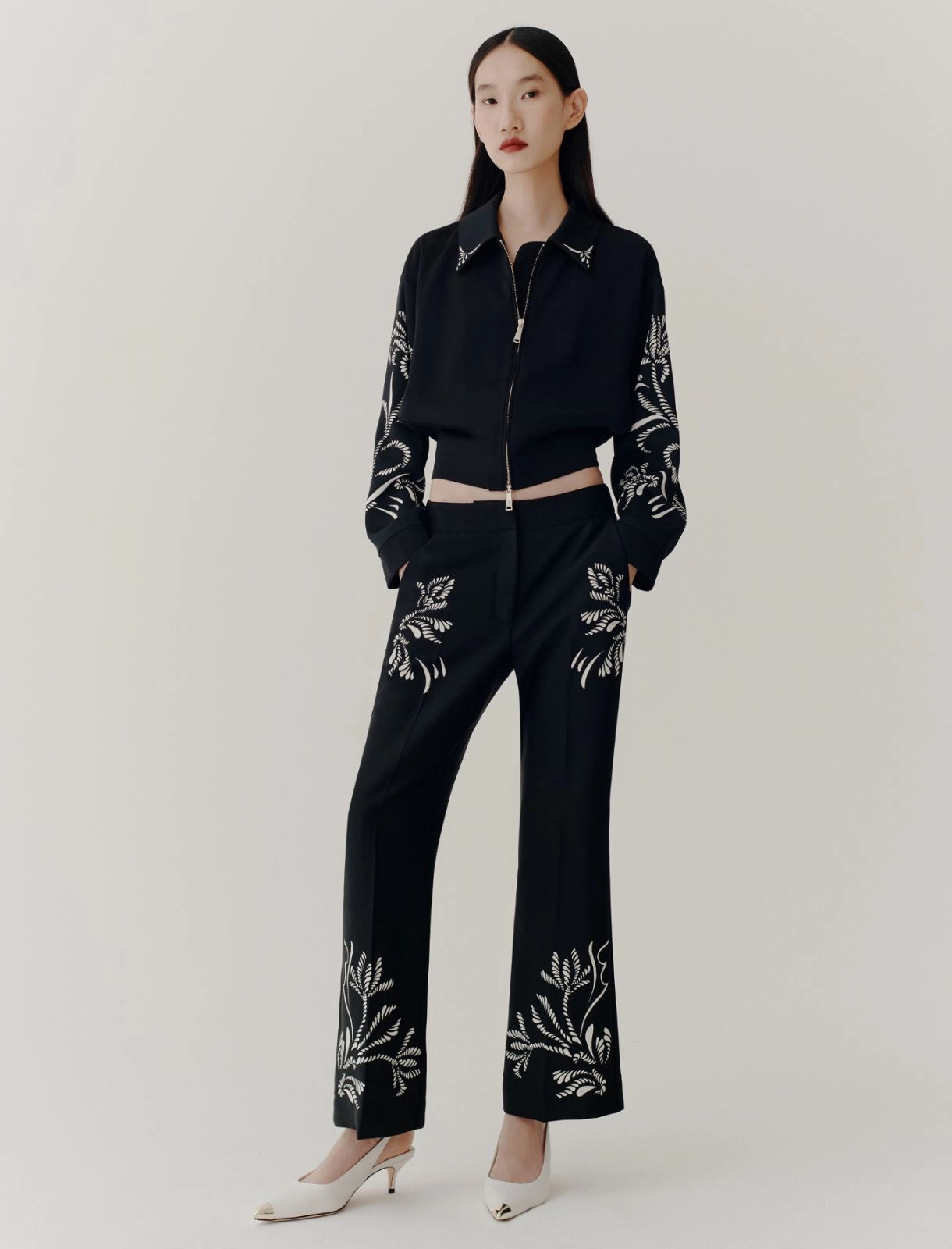 black placed flared satin trousers