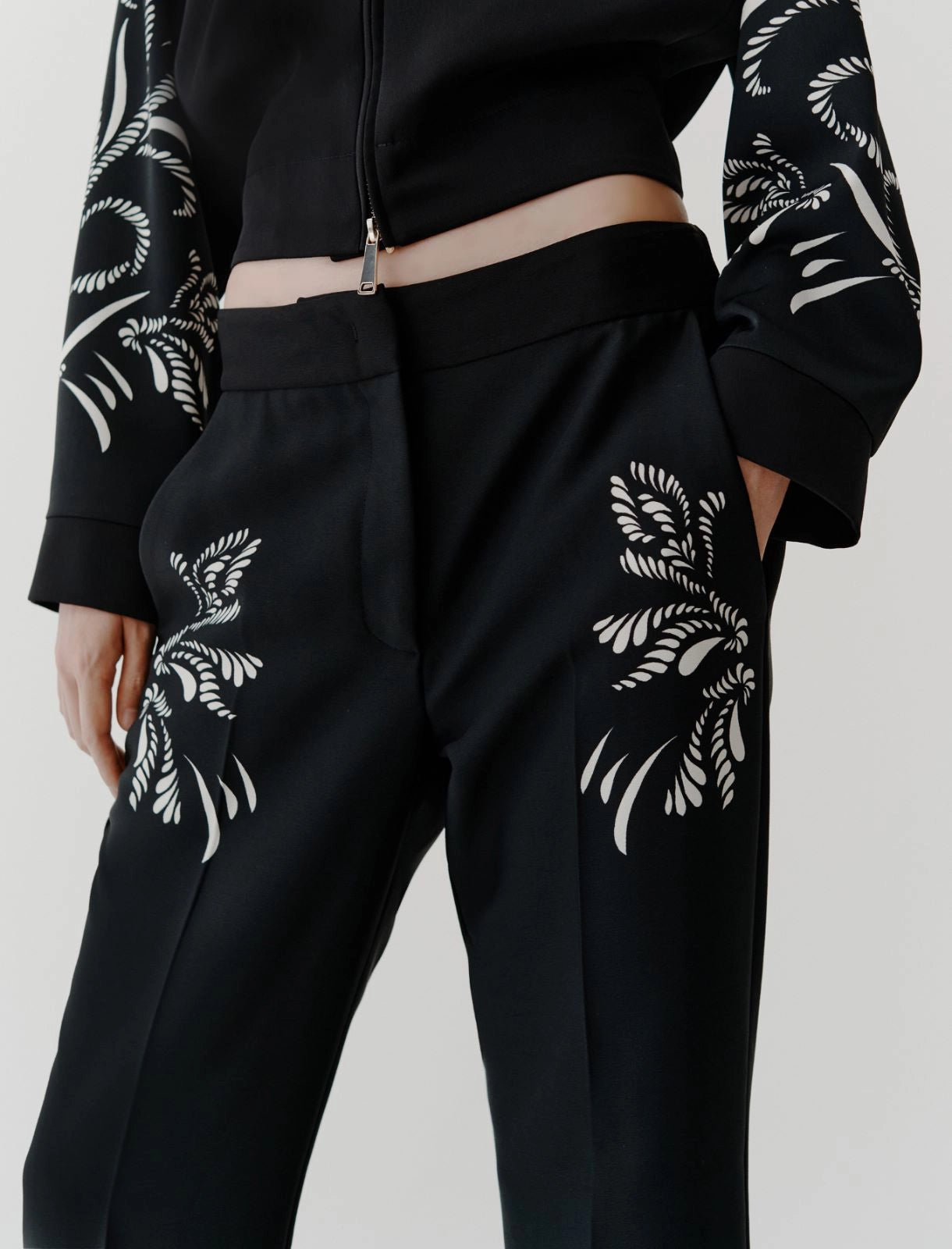 black placed flared satin trousers