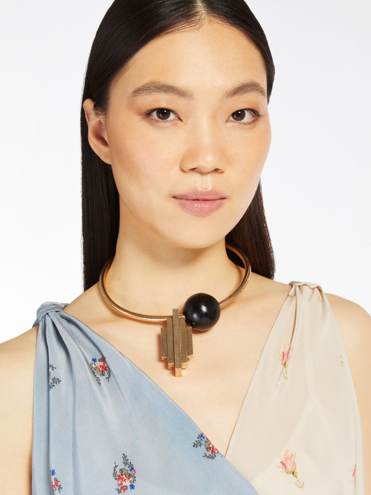 gold dune necklace in metal and wood