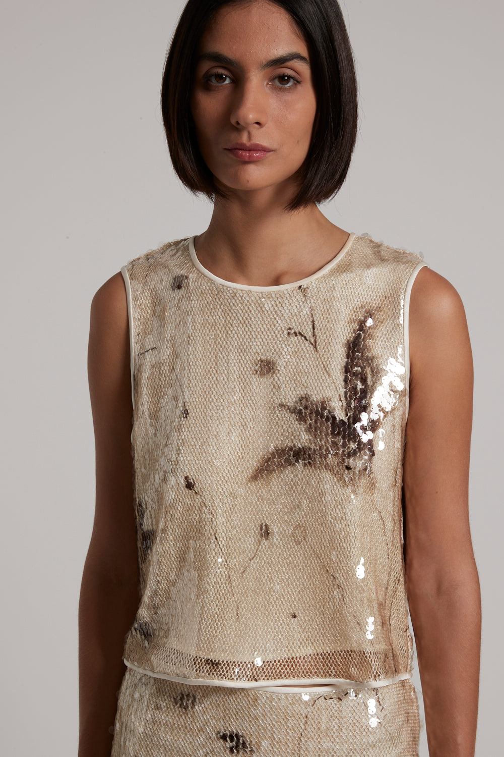 woman printed sequin on lurex net top